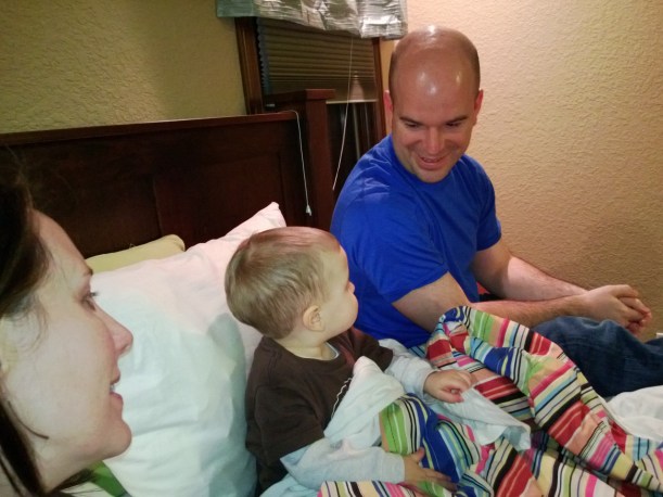 Matthew loves to sit in bed with us to watch Curio.us Geo.rge - morning, day, and night.  We usually cover his feet with the comforter, but on this day, he pulled the blanket all the way up to stay nice and toasty!