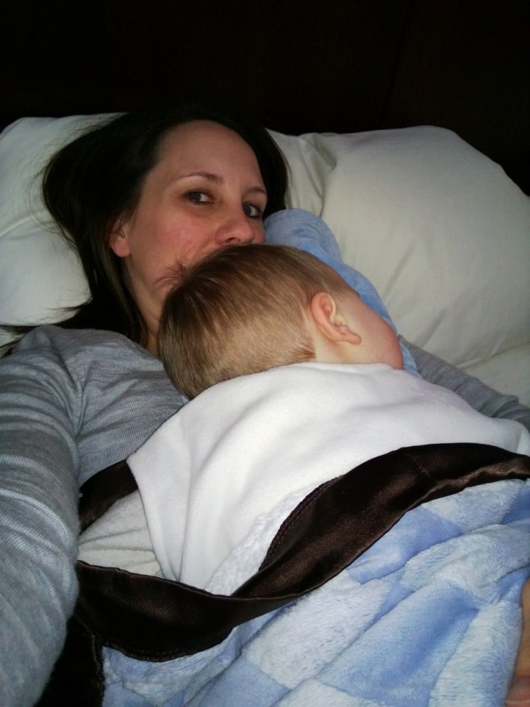 Mom trying to salvage a nap.  This was heaven, for about 2 minutes at a time before he would scream out in tummy pain.  Stupid Chipo.tle salsa!