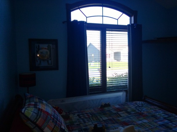 This is a terrible picture, but here are the curtains and print hung up! Those curtains to block the light well!